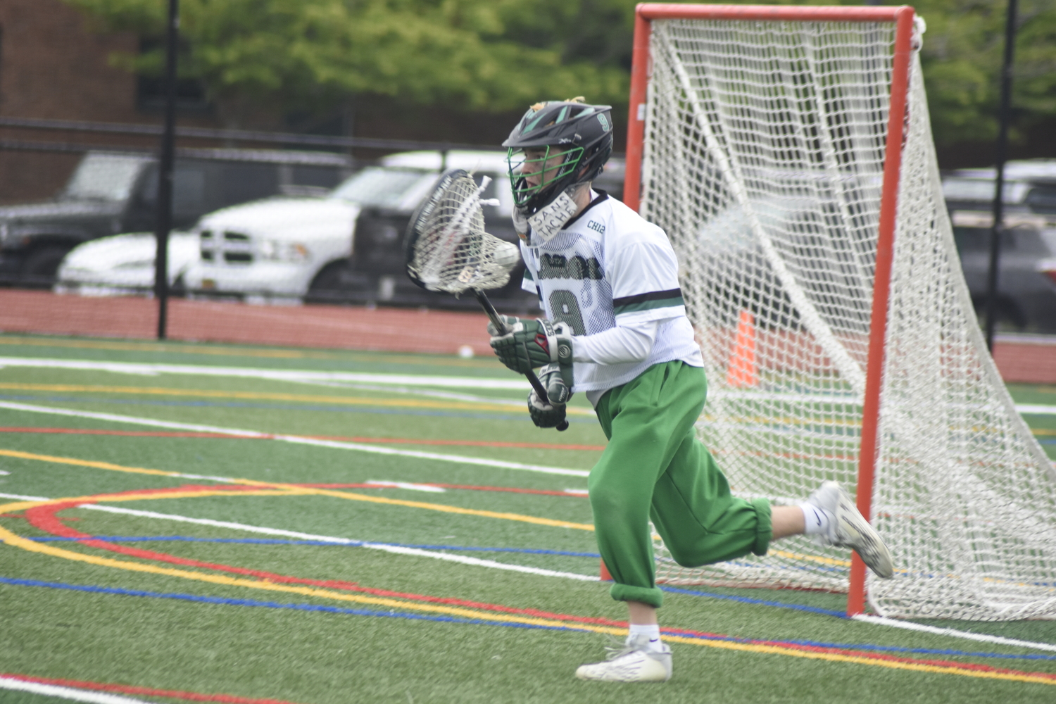 Westhampton Beach junior goalie Charlie Beasley races the ball out of his crease.   DREW BUDD