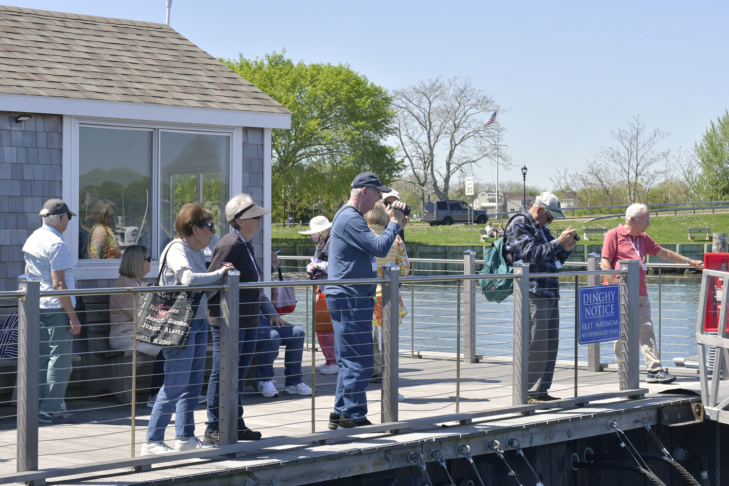 American Cruise Line passengers wait for their launch back to their ship at the dock in Sag Harbor on Tuesday.   DANA SHAW