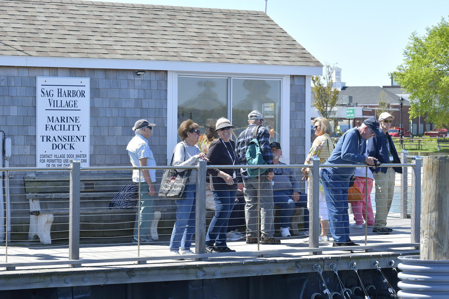 American Cruise Line passengers wait for their launch back to their ship at the dock in Sag Harbor on Tuesday.   DANA SHAW