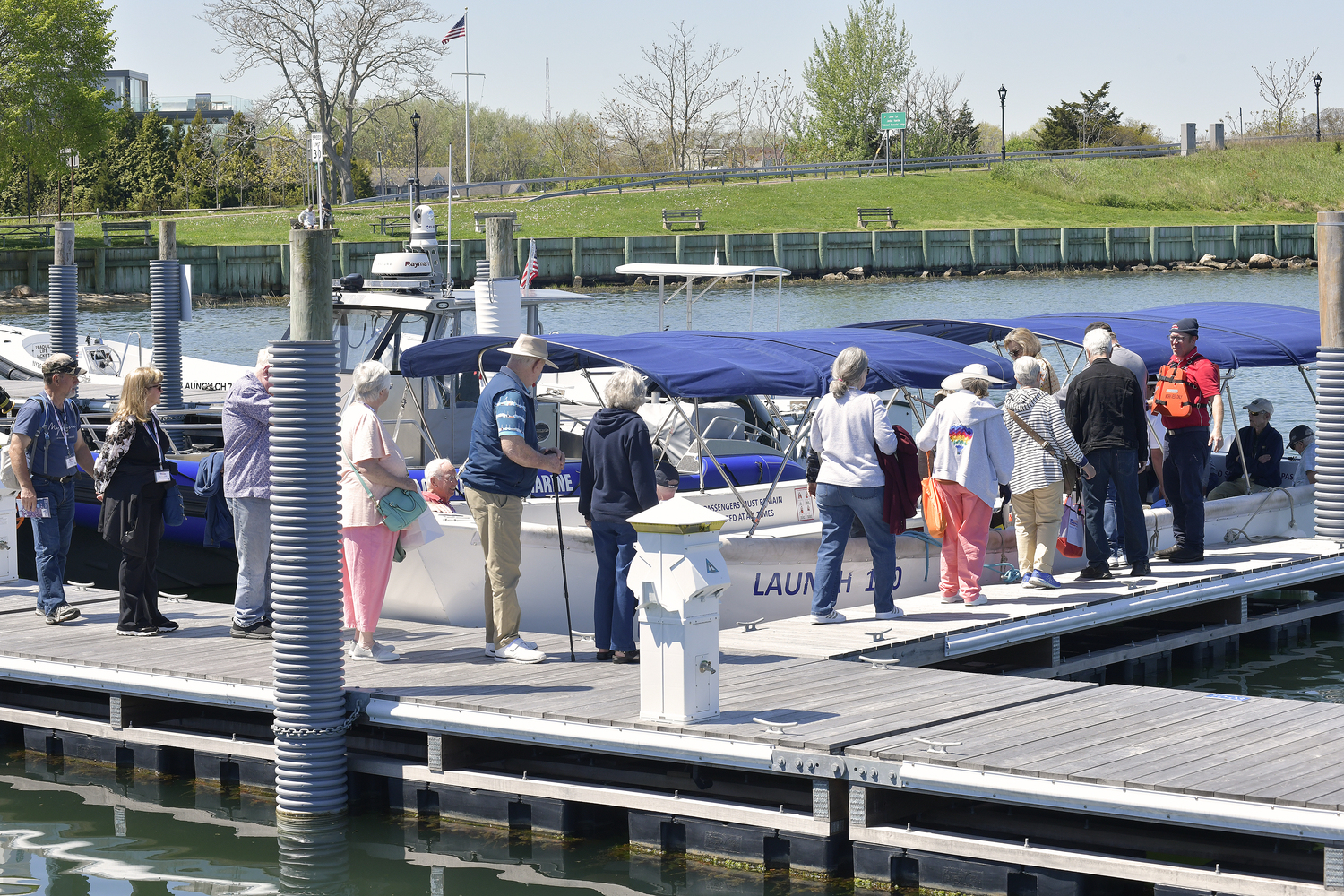 American Cruise Line passengers board their launch back to their ship at the dock in Sag Harbor on Tuesday.   DANA SHAW