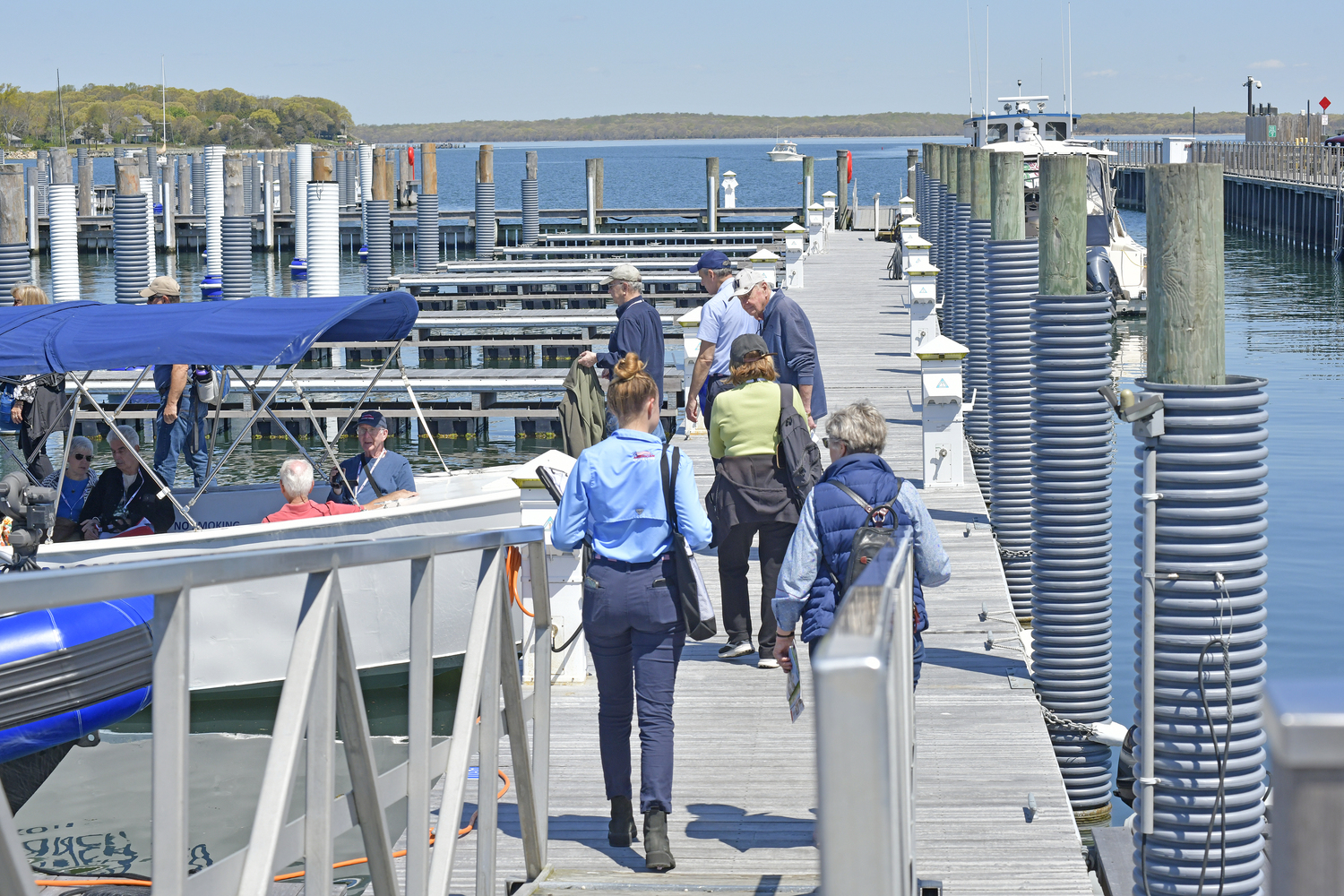 American Cruise Line passengers board their launch back to their ship at the dock in Sag Harbor on Tuesday.   DANA SHAW