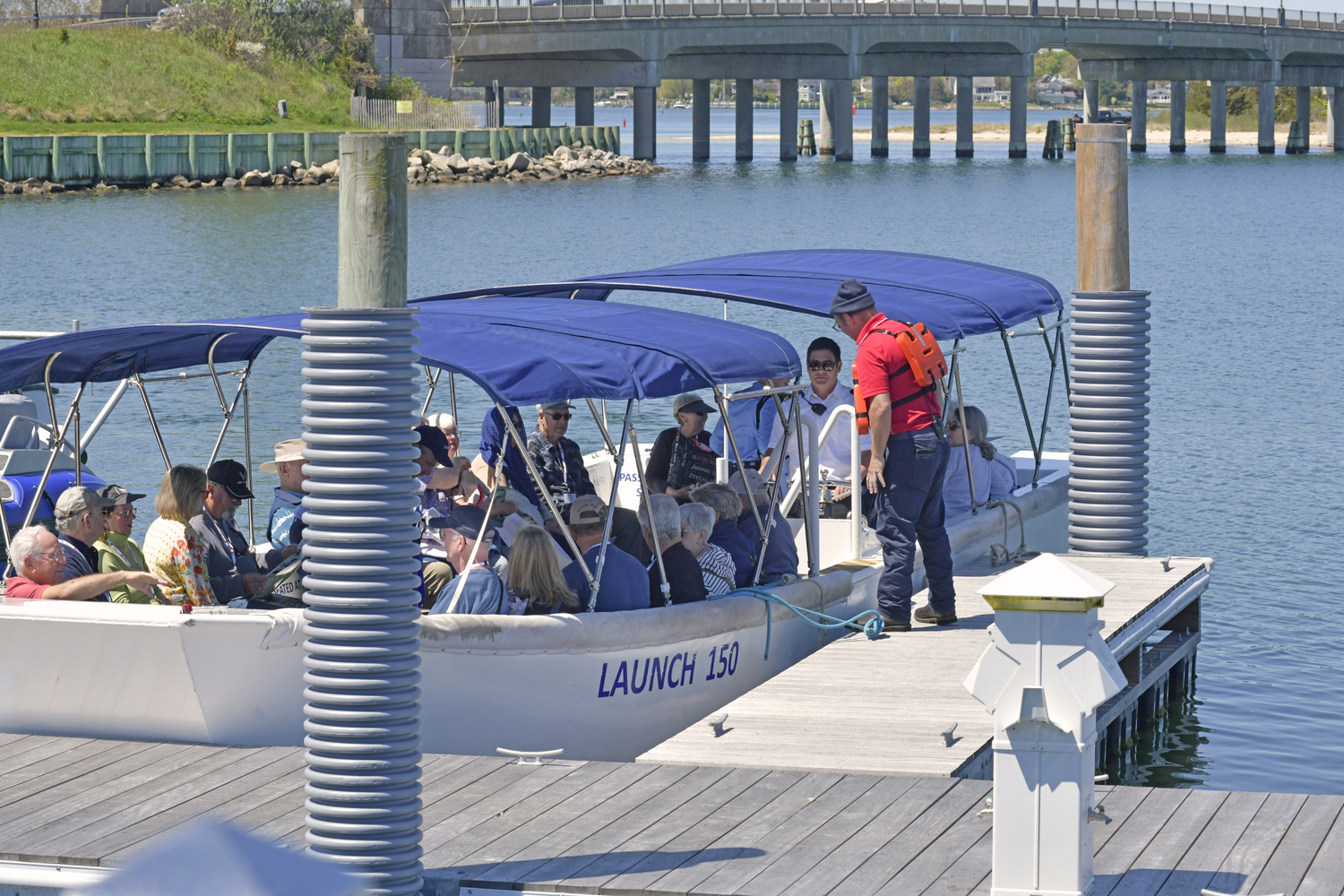 American Cruise Line passengers board their launch back to their ship at the dock in Sag Harbor on Tuesday.   DANA SHAW