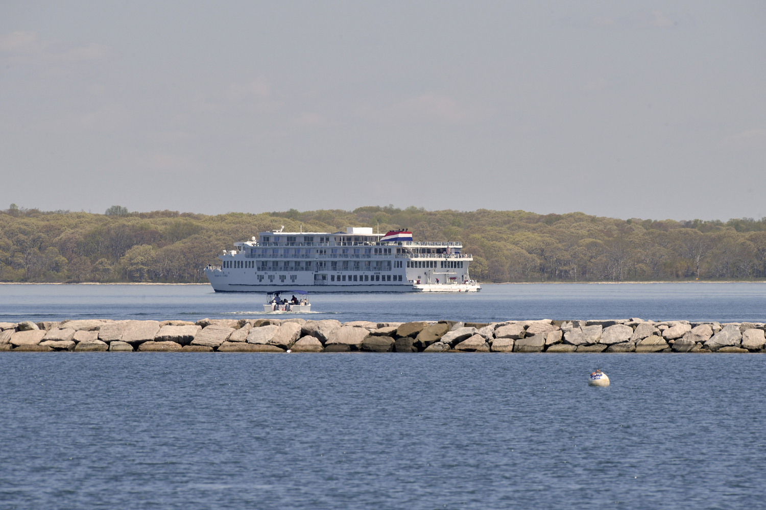 American Cruise Line passengers make their way back to their ship, anchored beyond the breakwater in Sag Harbor on Tuesday.   DANA SHAW