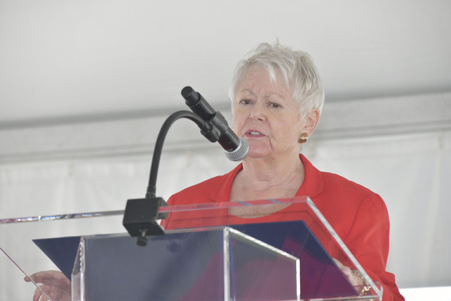 Emilie Roy Corey, MSW, chair of the Peconic Bay Medical Center Foundation board welcomes the crowd to the ribbon cutting and dedication ceremony for the Poole Family Trauma and Emergency Center May 23.  DANA SHAW