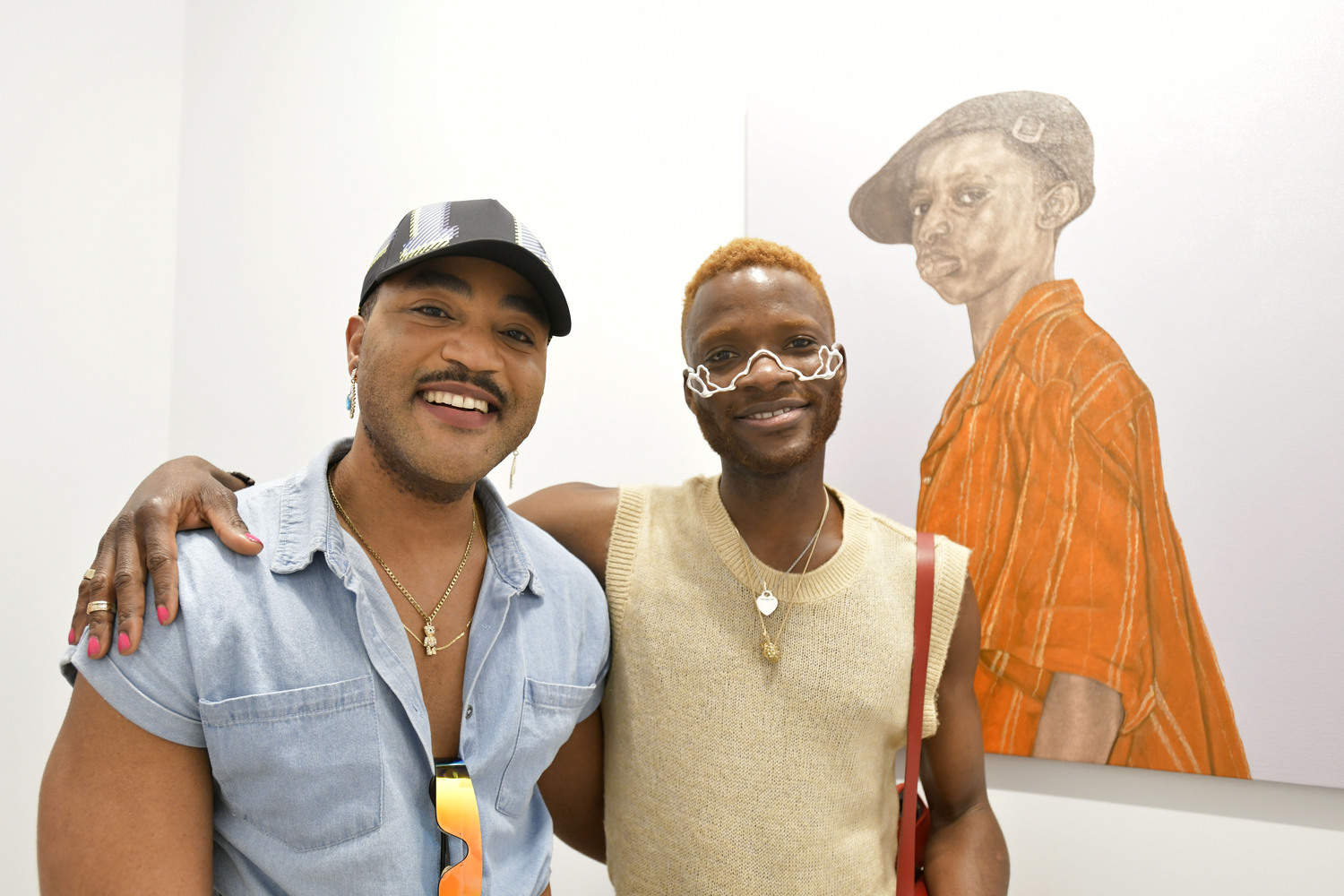 Dayo Ephraim and Ayo Otuyelo at the opening reception for Mayowa Nwadike's  exhibit, 