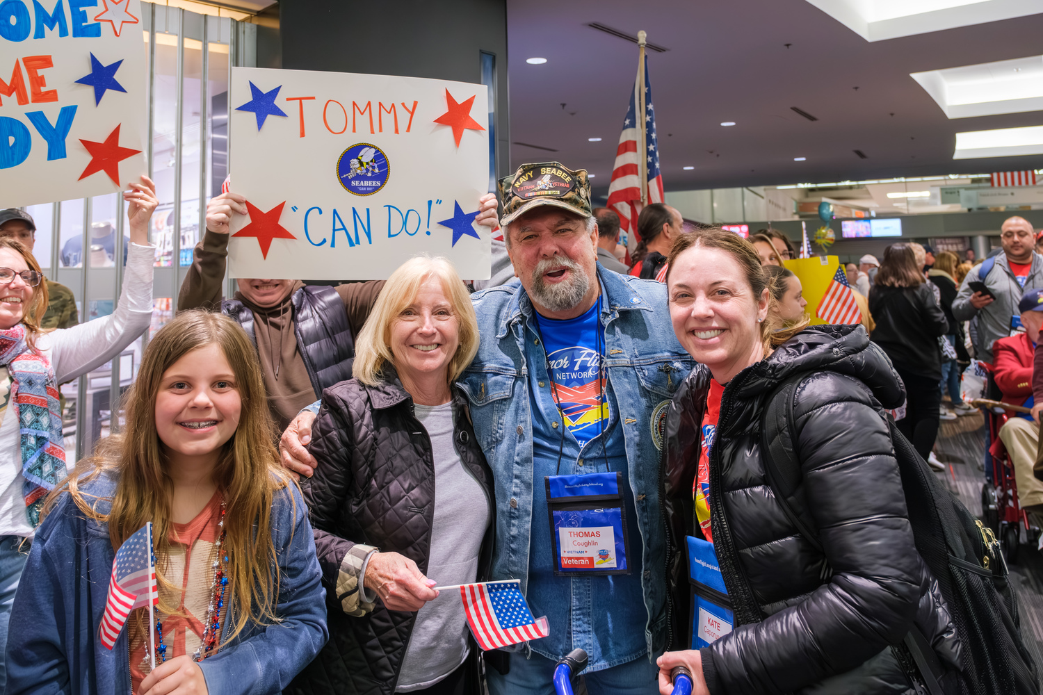 Vietnam veteran Thomas Coughlin surrounded by his family after he returned home from the Honor Flight. MARK CHAMBERLAIN