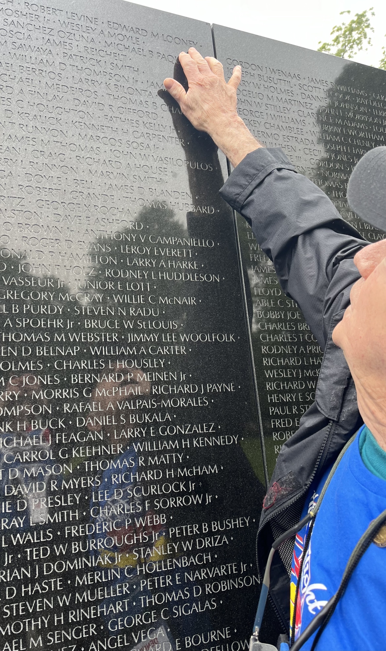 Vietnam War veteran Dennis Riordan points out a fallen comrade's name. MARIA MOORE