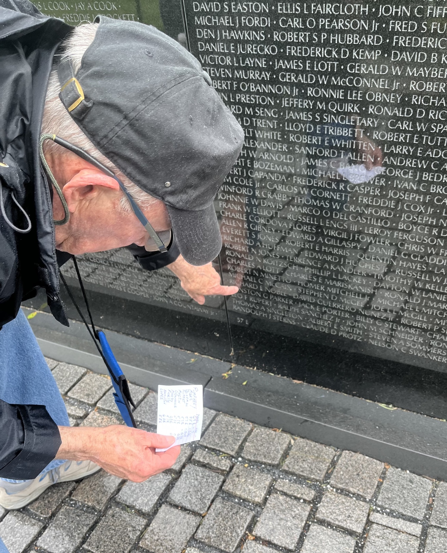Vietnam War veteran Dennis Riordan points out a fallen comrade's name. MARIA MOORE