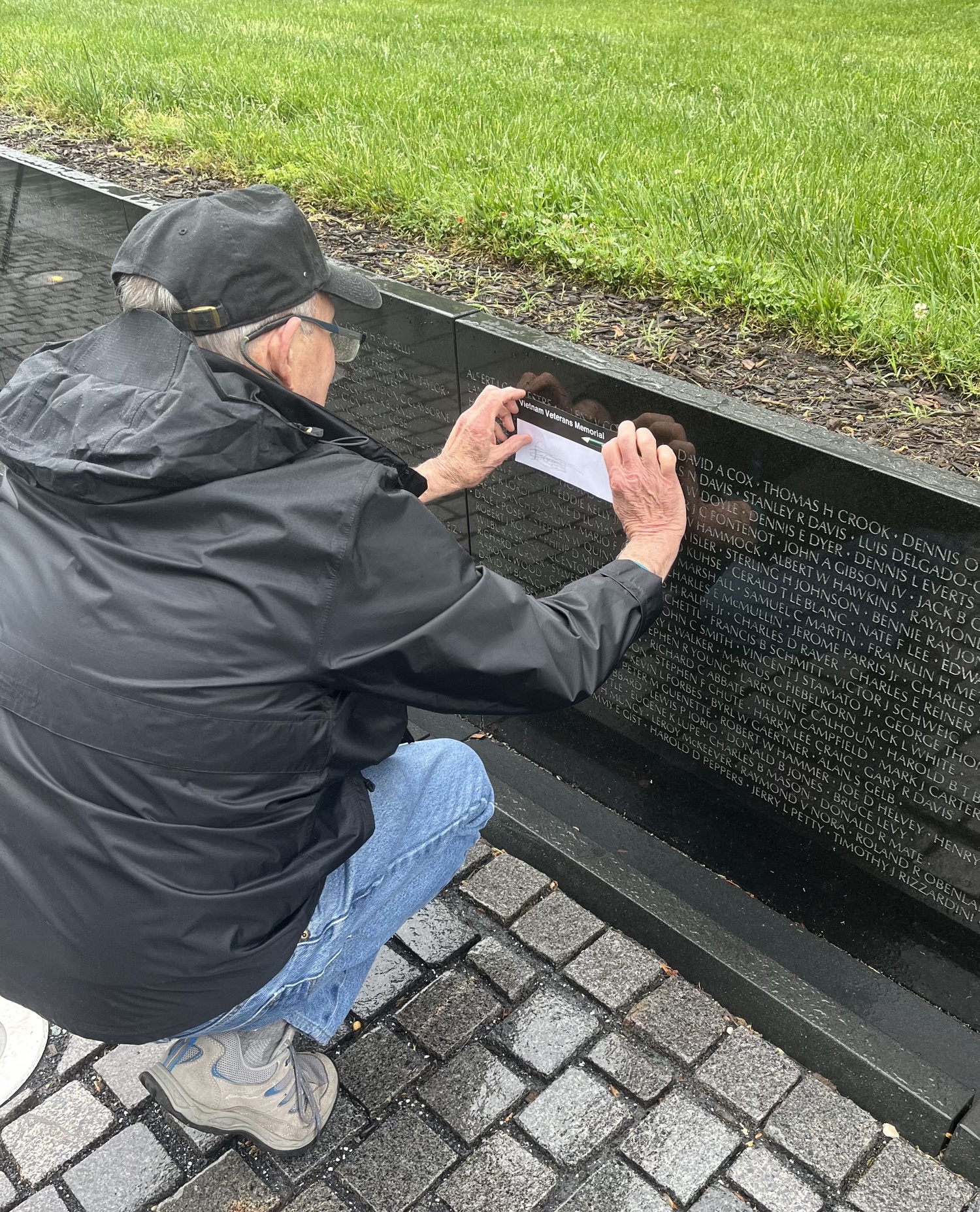Vietnam War veteran Dennis Riordan makes an etching of a fallen comrade's name. MARIA MOORE