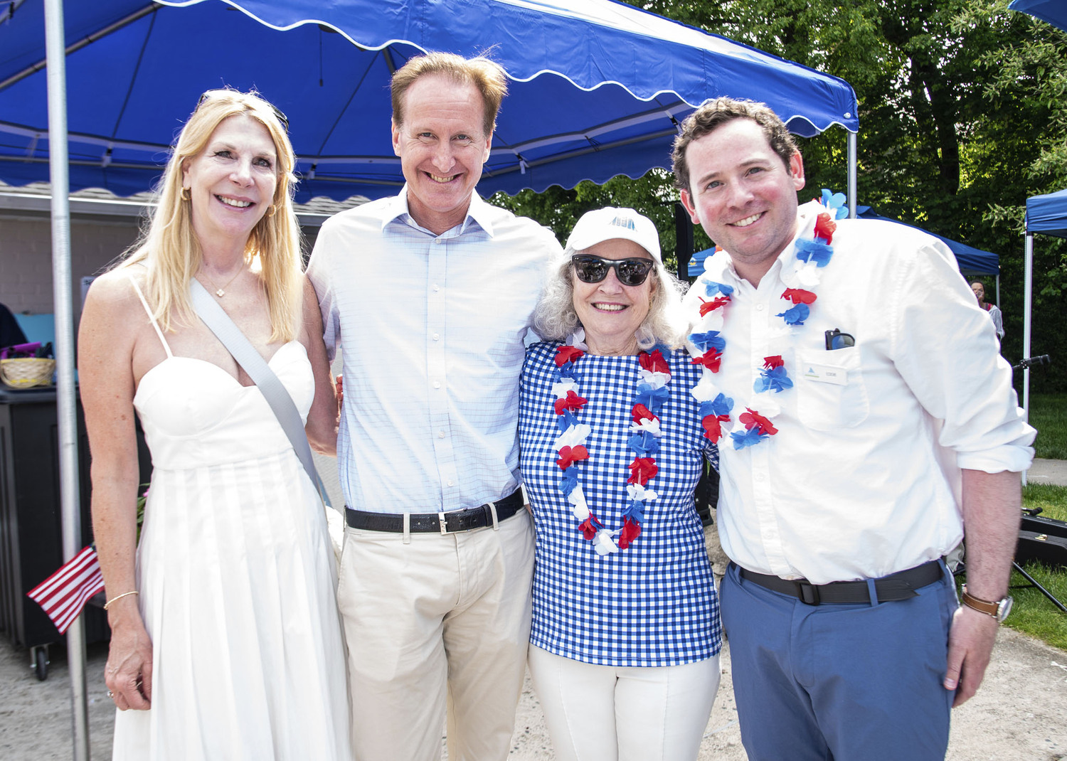 Catherine Larsen, Southampton Village Mayor Bill Manger, Dede Gotthelf and Eddie Moan at the Southampton Inn's annual Memorial Day barbeque on Sunday.  LISA TAMBURINI