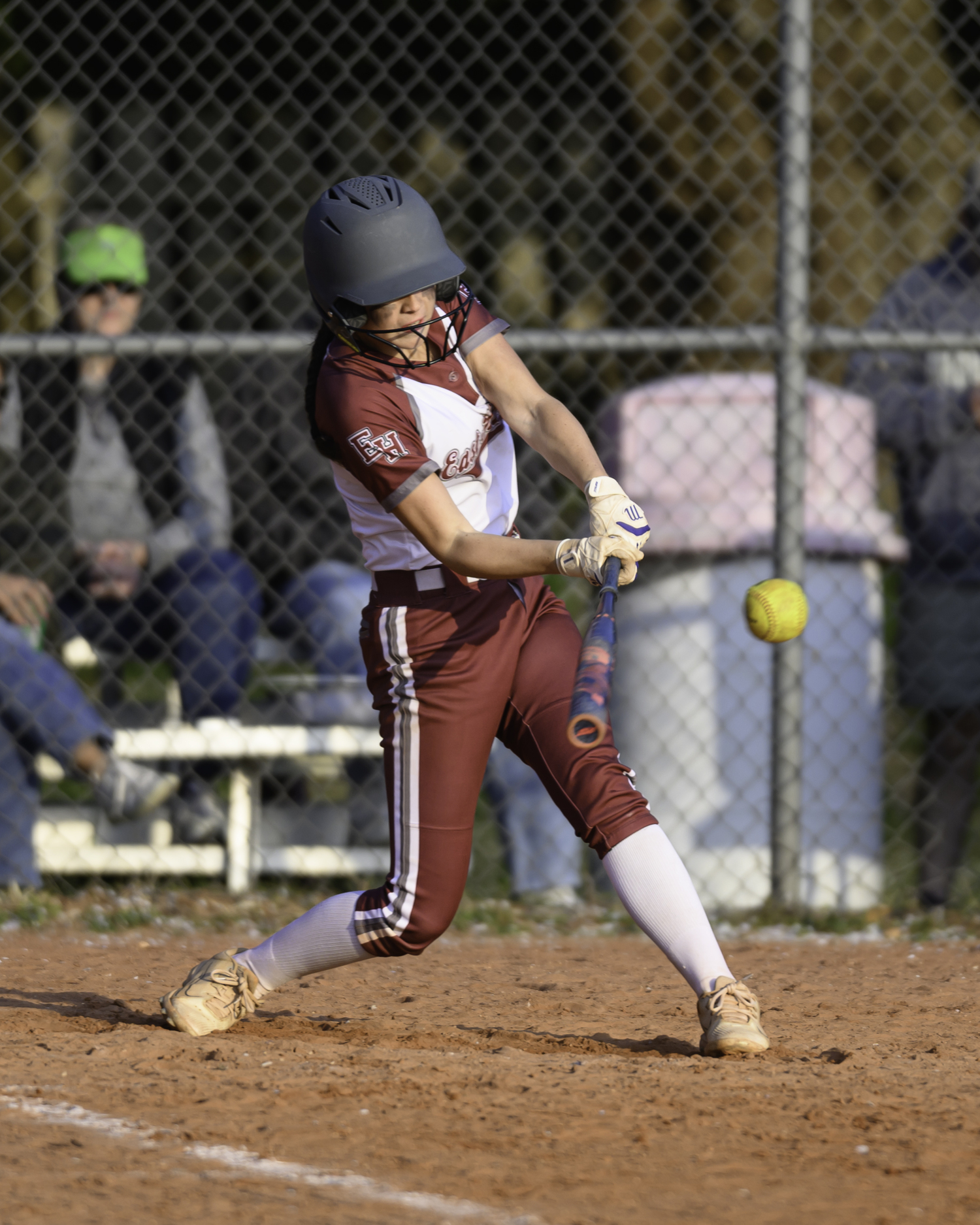 East Hampton sophomore Colleen McKee lines up a base hit.  MARIANNE BARNETT