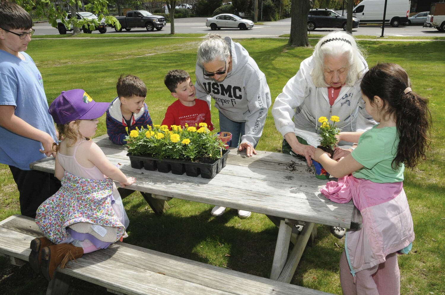 On Saturday, local John Marshall Elementary School students were invited to paint a flower pot and plant a flower for Mom on Mother's Day, at the East Hampton Town Historical Farm Museum. Alice Wood curated the event.   RICHARD LEWIN