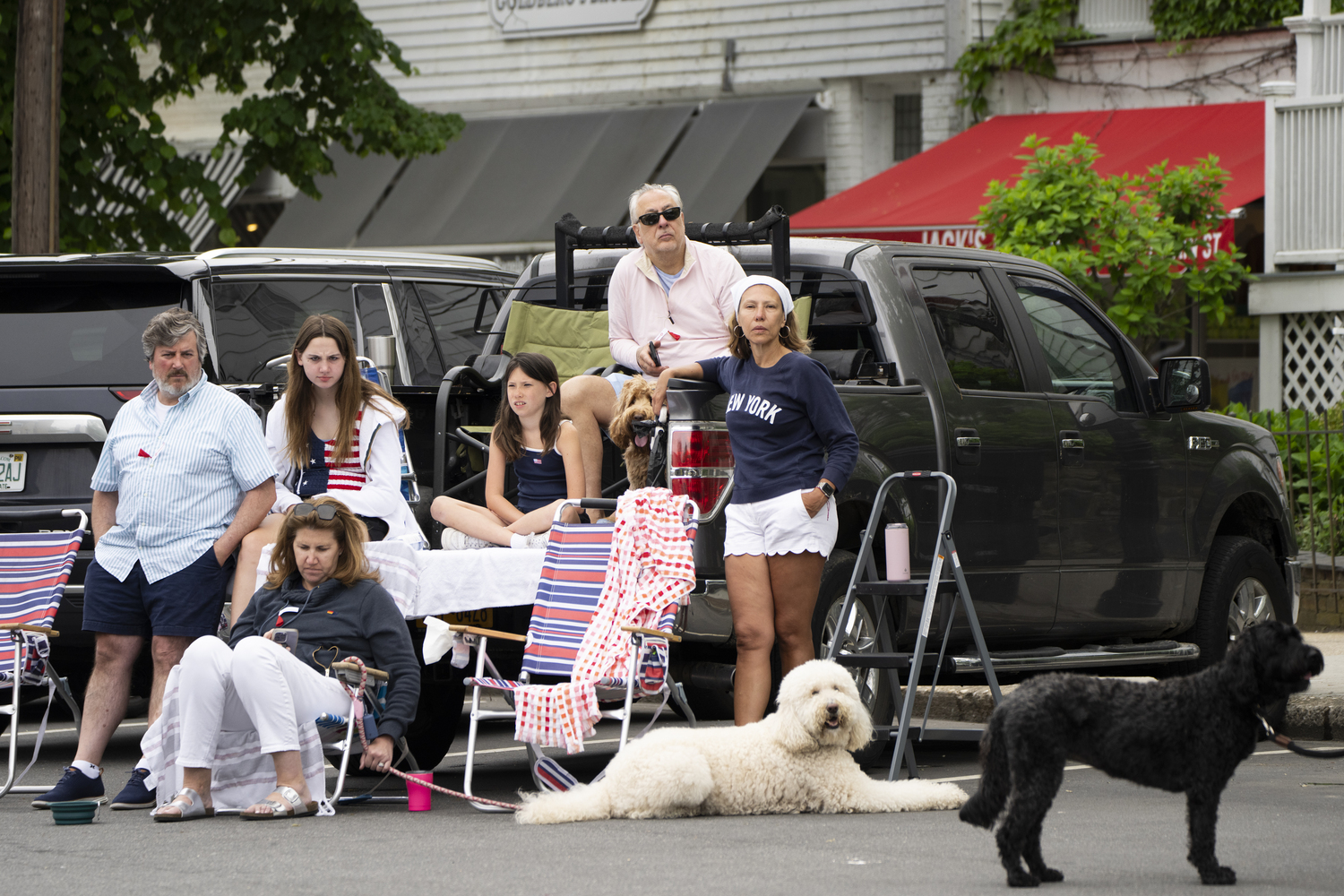 A family watches the Sag Harbor Memorial Day parade on Main Street. LORI HAWKINS