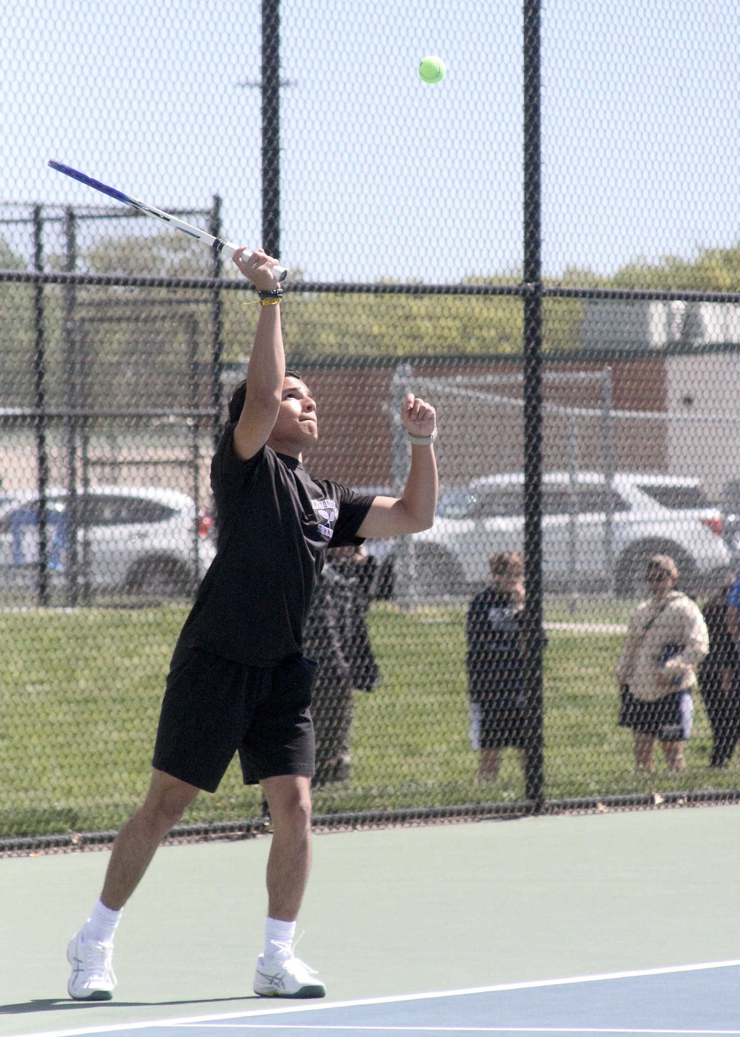 Hampton Bays junior Kevin David Saa Pacheco serves. DESIRÉE KEEGAN