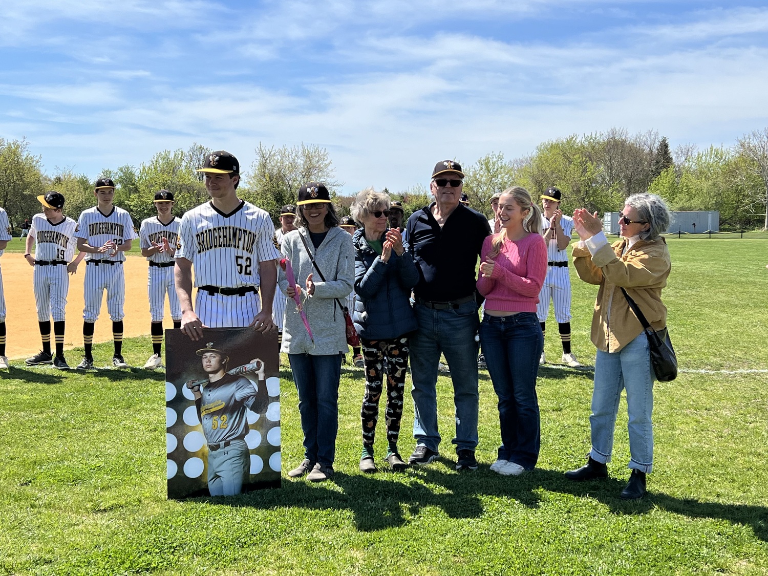 Milo Tompkins was honored as the Bridgehampton/Ross baseball teams lone senior captain prior to playing Amityville on Saturday.  JULIE FOARD