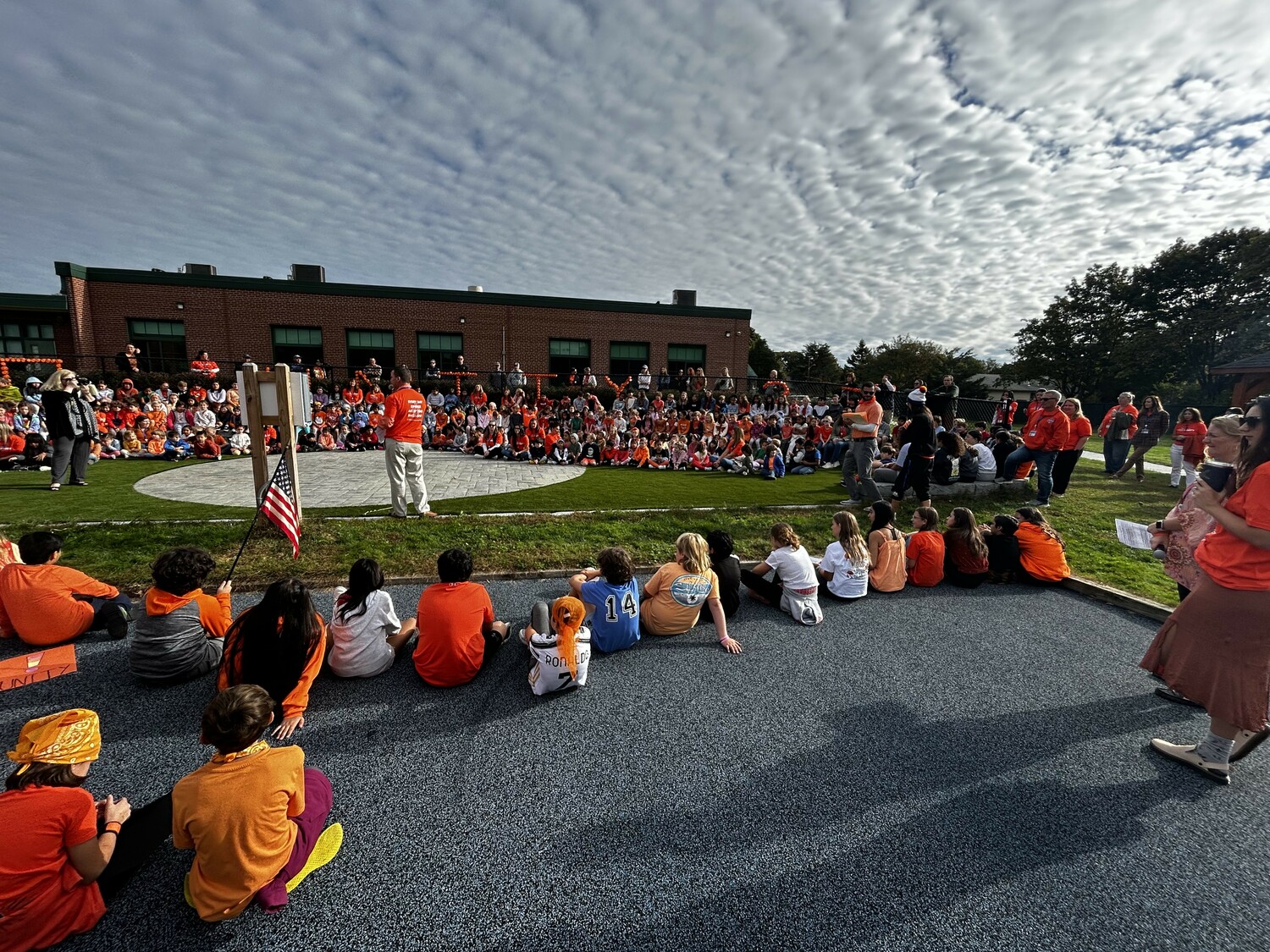 East Quogue School students during a whole school meeting at the school's outdoor amphitheater.