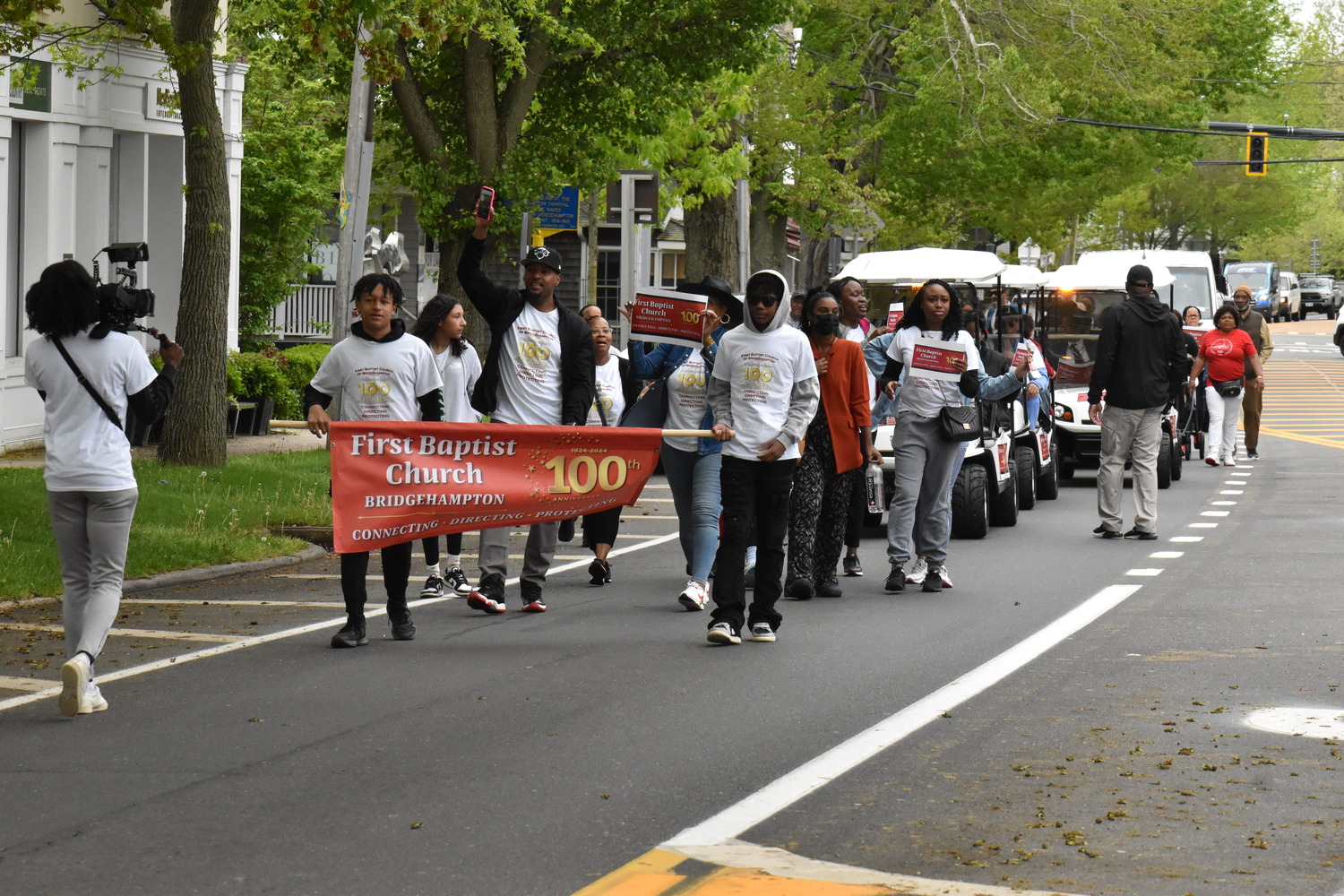 Members of the First Baptist Church of Bridgehampton marched on Montauk Highway on Sunday from their original home on Corwith Avenue to their current church on the Bridghampton-Sag Harbor Turnpike to celebrate the congregation's centennial. STEPHEN J. KOTZ