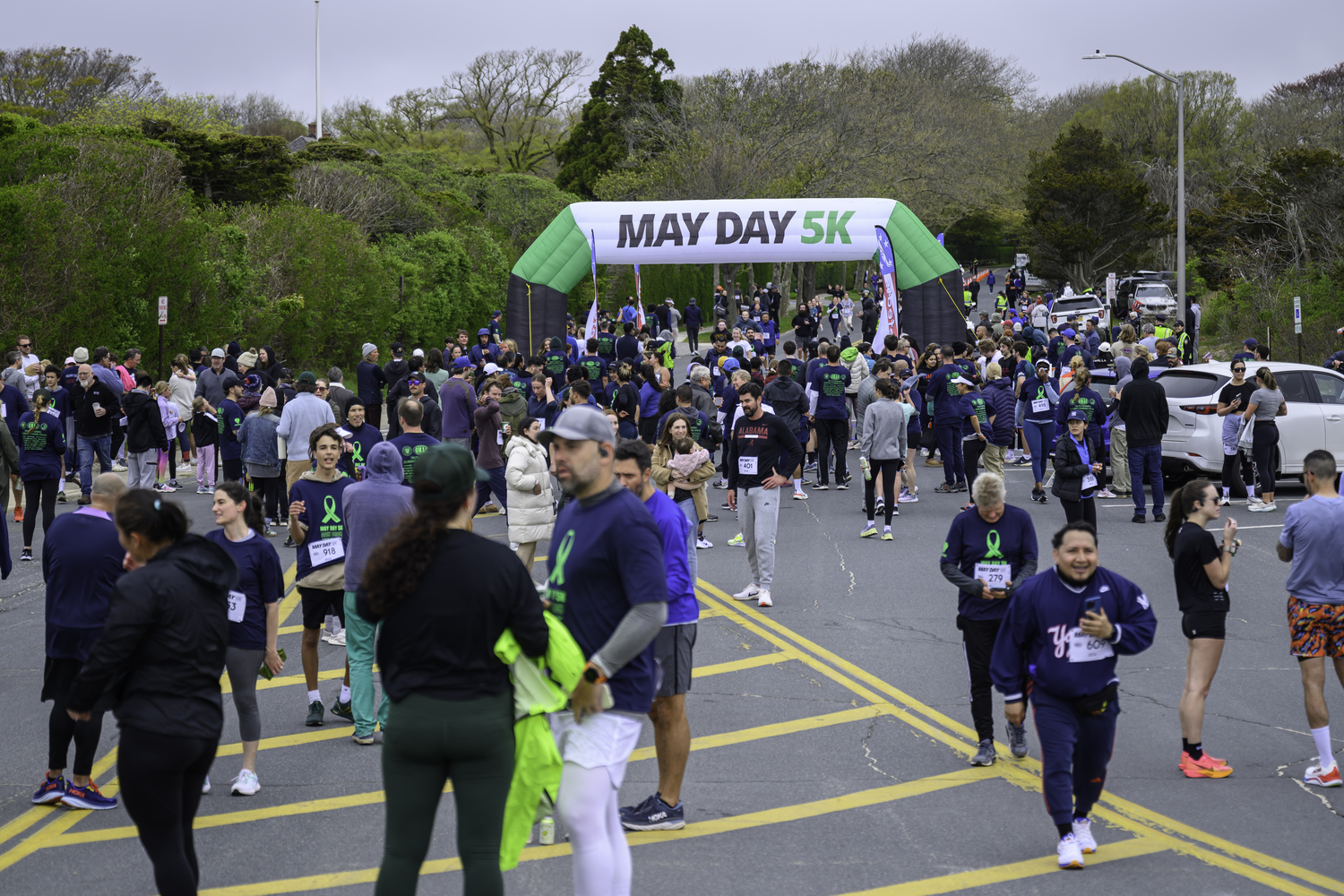 Close to 800 people participated in the third annual May Day 5K at Main Beach in East Hampton on Sunday morning.   MARIANNE BARNETT