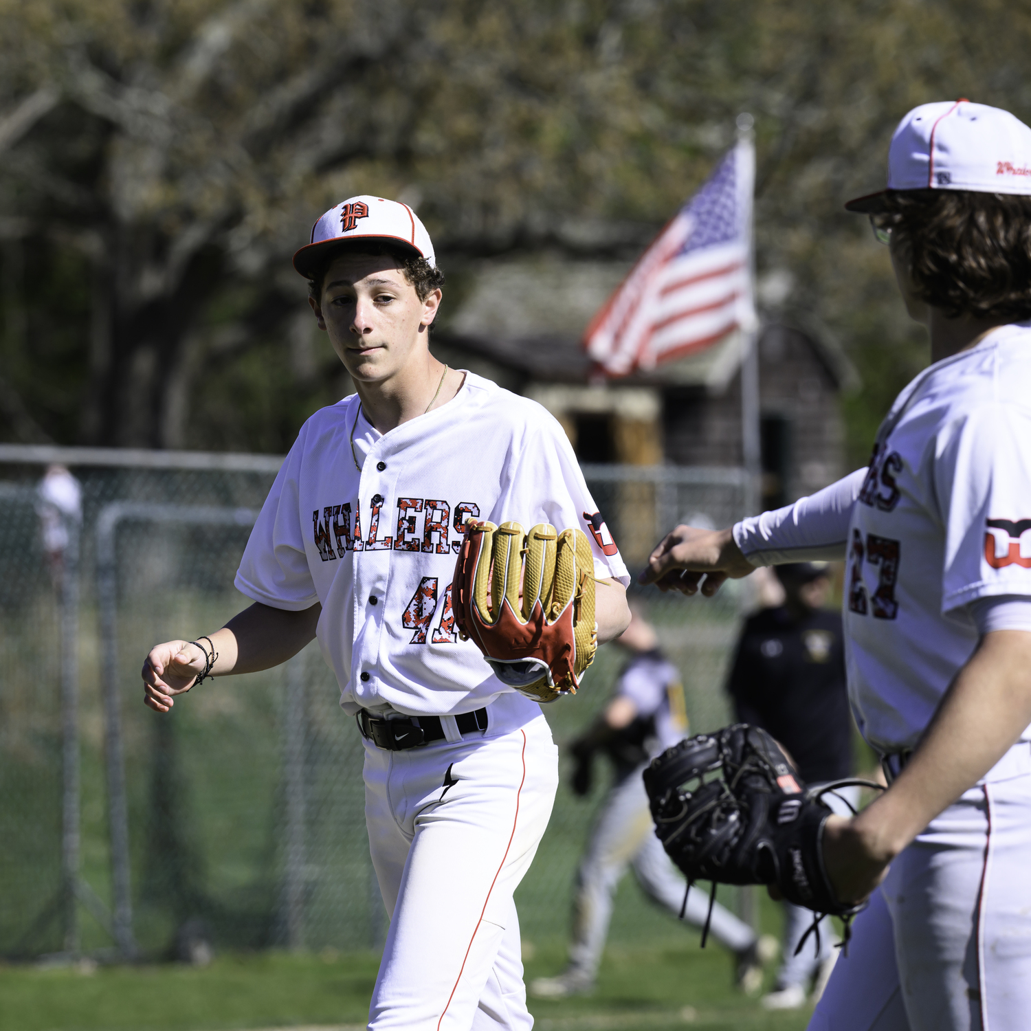 Pierson starting pitcher Andy Wayne is congratulated by first baseman Charles Schaefer after a strong first inning on May 1.  MARIANNE BARNETT