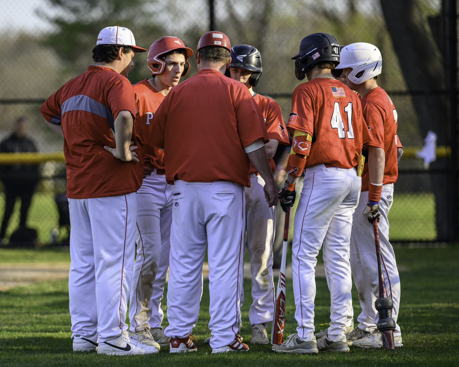 Bob Manning meets with his team during a game at Southold this season.   MARIANNE BARNETT