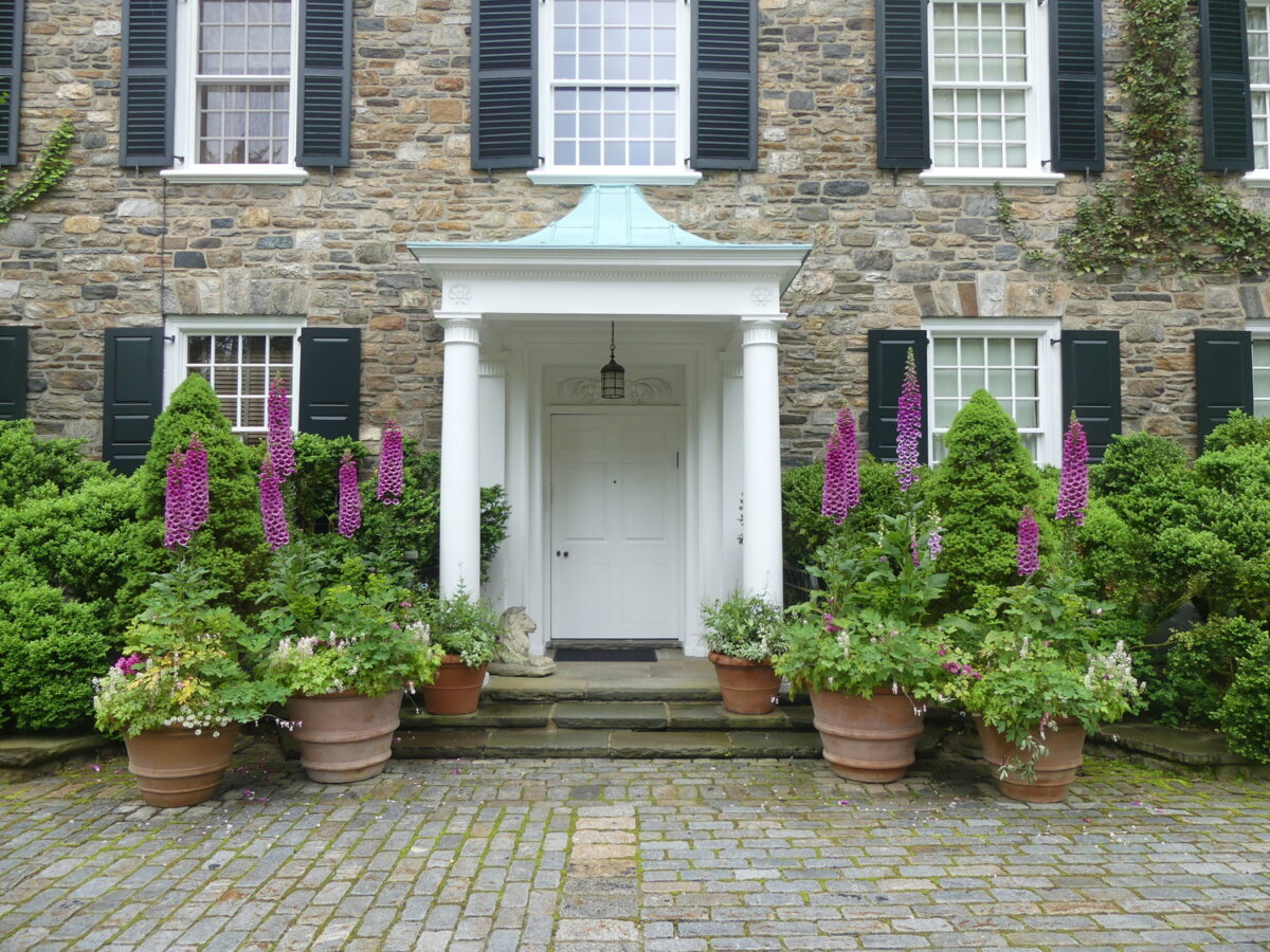 If you have the money and staff you can do large terracotta pots like these for seasonal displays. Potted, mature plants like the tall digitalis and shorter bleeding hearts and some annuals are seen here in late May. Soon, a summer planting will replace this scene and again another planting in the fall.
ANDREW MESSINGER