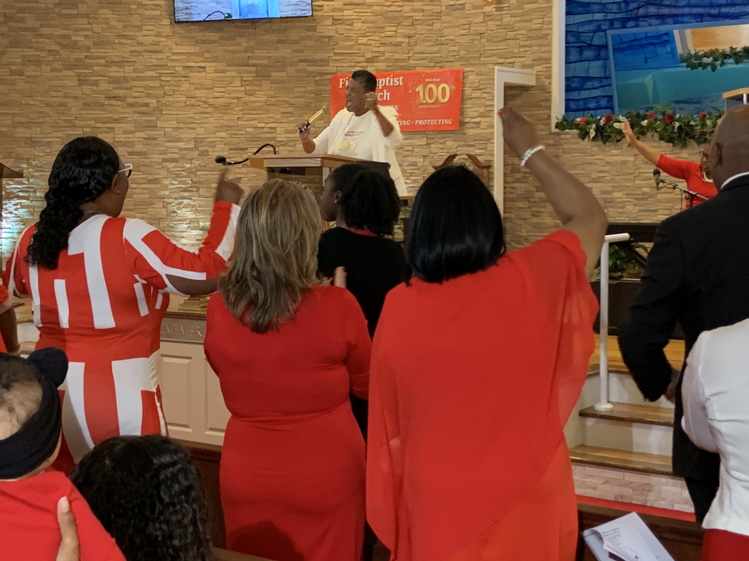 The Reverend Tisha Williams preaching at the First Baptist Church of Bridgehampton's centennial observance on Sunday. STEPHEN J. KOTZ