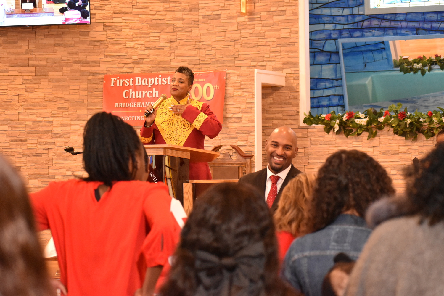 The Reverend Tisha Williams preaching at the First Baptist Church of Bridgehampton's centennial observance on Sunday. STEPHEN J. KOTZ