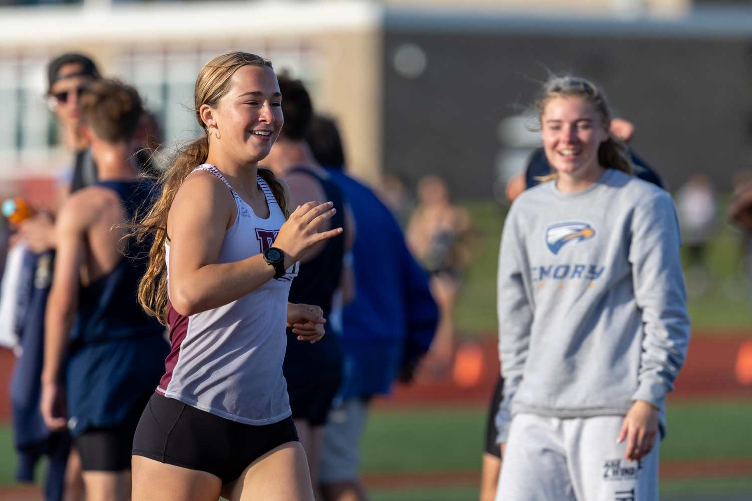 Dylan Cashin being cheered on by teammate Ryleigh O'Donnell as she competes in the 1,500-meter race walk. RON ESPOSITO