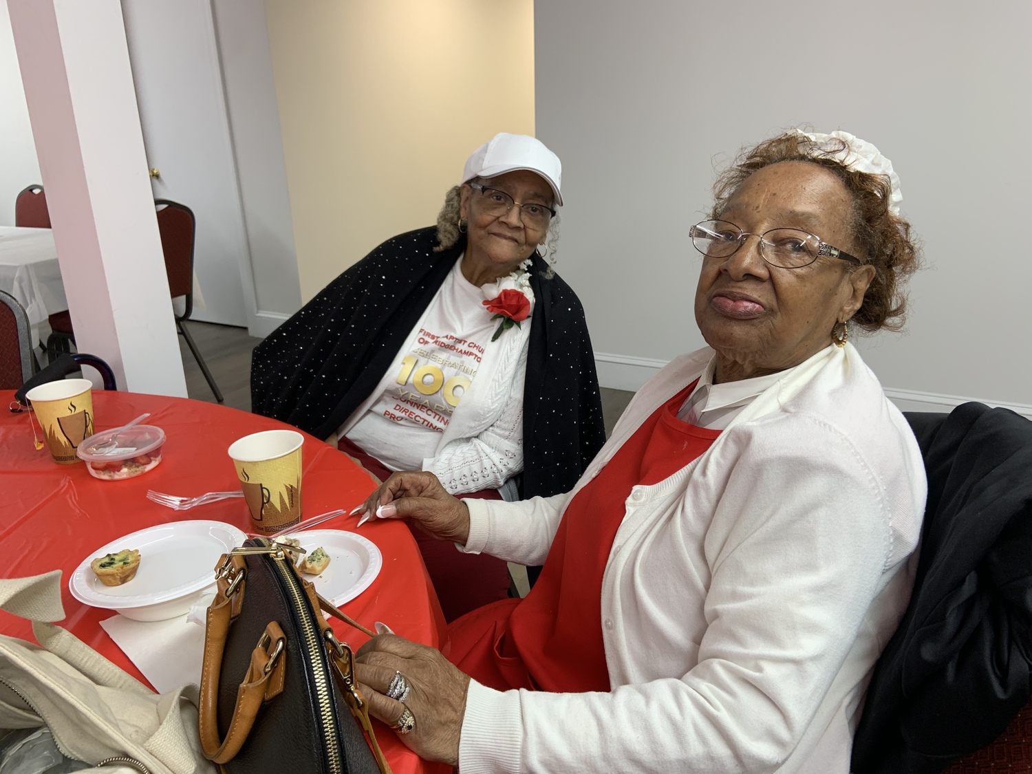 Betty Gilliam, left, and Vivian Graham, two long-time congregants at breakfast before Sunday's services. STEPHEN J. KOTZ