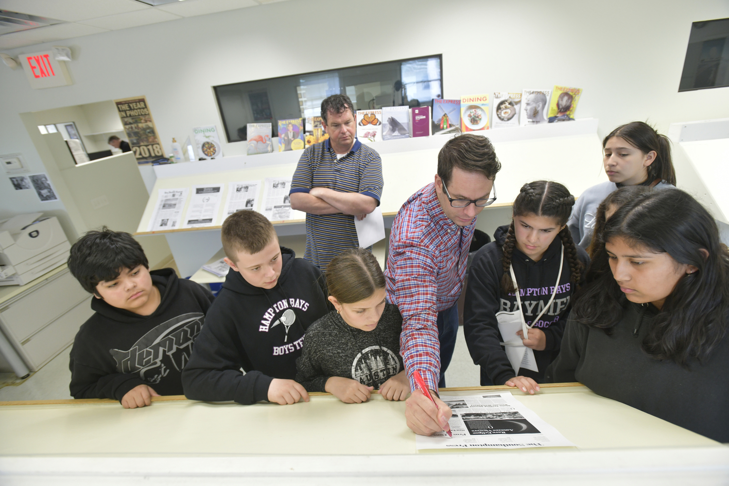 Hampton Bays Middle School students visited  Express News Group offices on May 3 as part of their News Literacy elective class. Students  learned about the importance of local journalism and verifying information. Joe Shaw, the Executive Editor, took the students on a tour of the facility and led a discussion on the role of news reporting in modern society, with several members of the staff facilitating conversation with the students. Students were also given a newsroom simulation activity, where they edited their own op-ed articles, selected artwork to accompany their articles, and worked in the production department to layout their own version of The Southampton Press. The start-to-finish process gave students insight into the real-life decision making that goes into working for a newspaper.  DANA SHAW