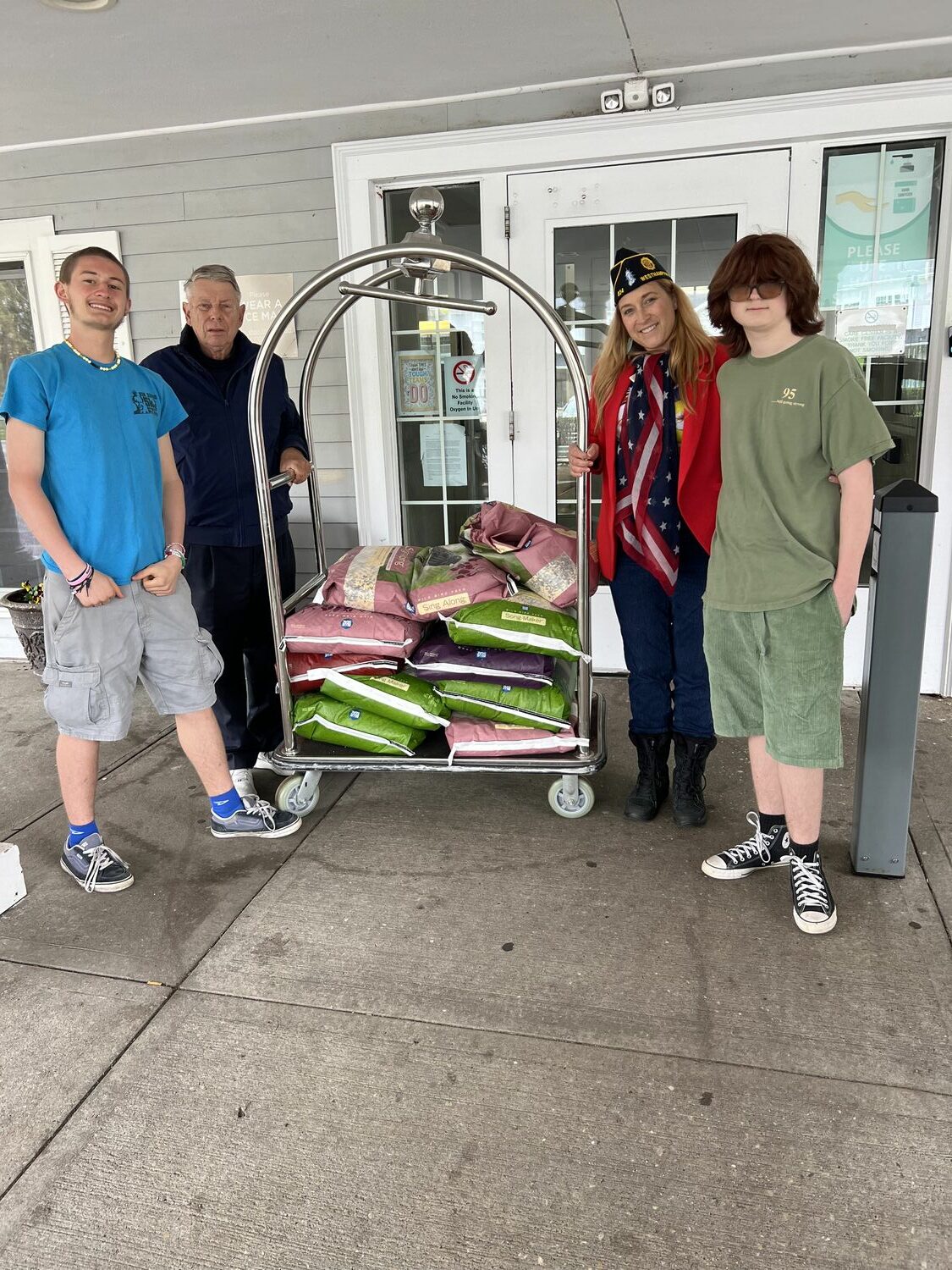 Members of the Westhampton American Legion delivered bird seed and bird feeders to the patients on the Westhampton Care Center, replacements for worn out bird feeders that had been outside patients' windows.  From left, Reed Terry, Tom Hadlock, Lisha Terry, and Race Terry made the delivery, with prep help from  Paul Haines and Sandy Wyman. COURTESY WESTHAMPTON AMERICAN LEGION