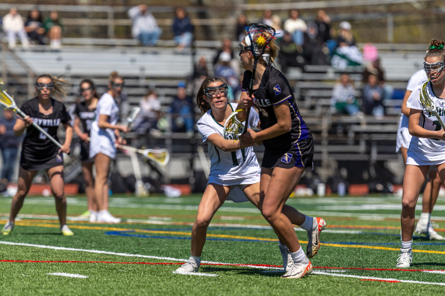 Junior defender Hailey Donahoe looks to stop an opponent in her tracks during a 9-5 loss to Sayville on April 26. RON ESPOSITO
