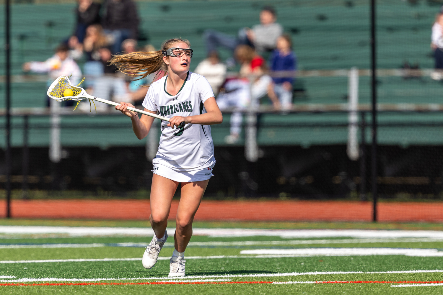 Junior midfielder Lily Graves looks for an open receiver during Westhampton Beach's 11-5 win over Miller Place April 24. RON ESPOSITO
