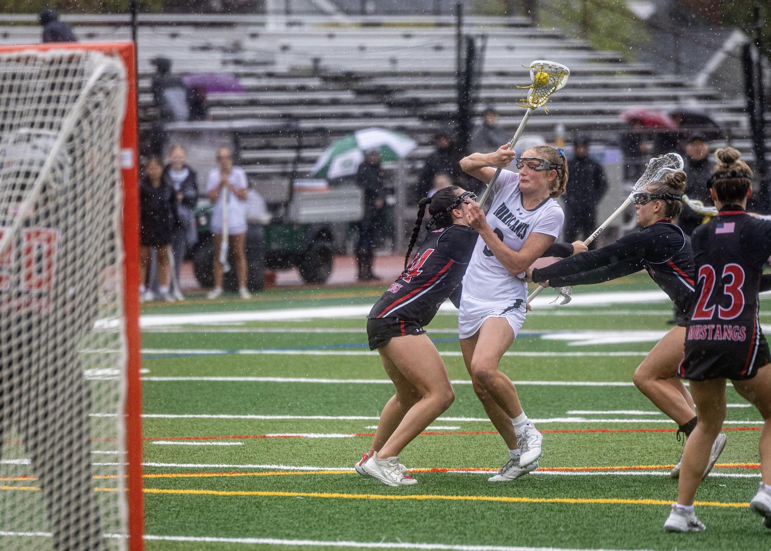 Junior midfielder Lily Graves bulls her way through Mt. Sinai defenders. MICHAEL O'CONNOR