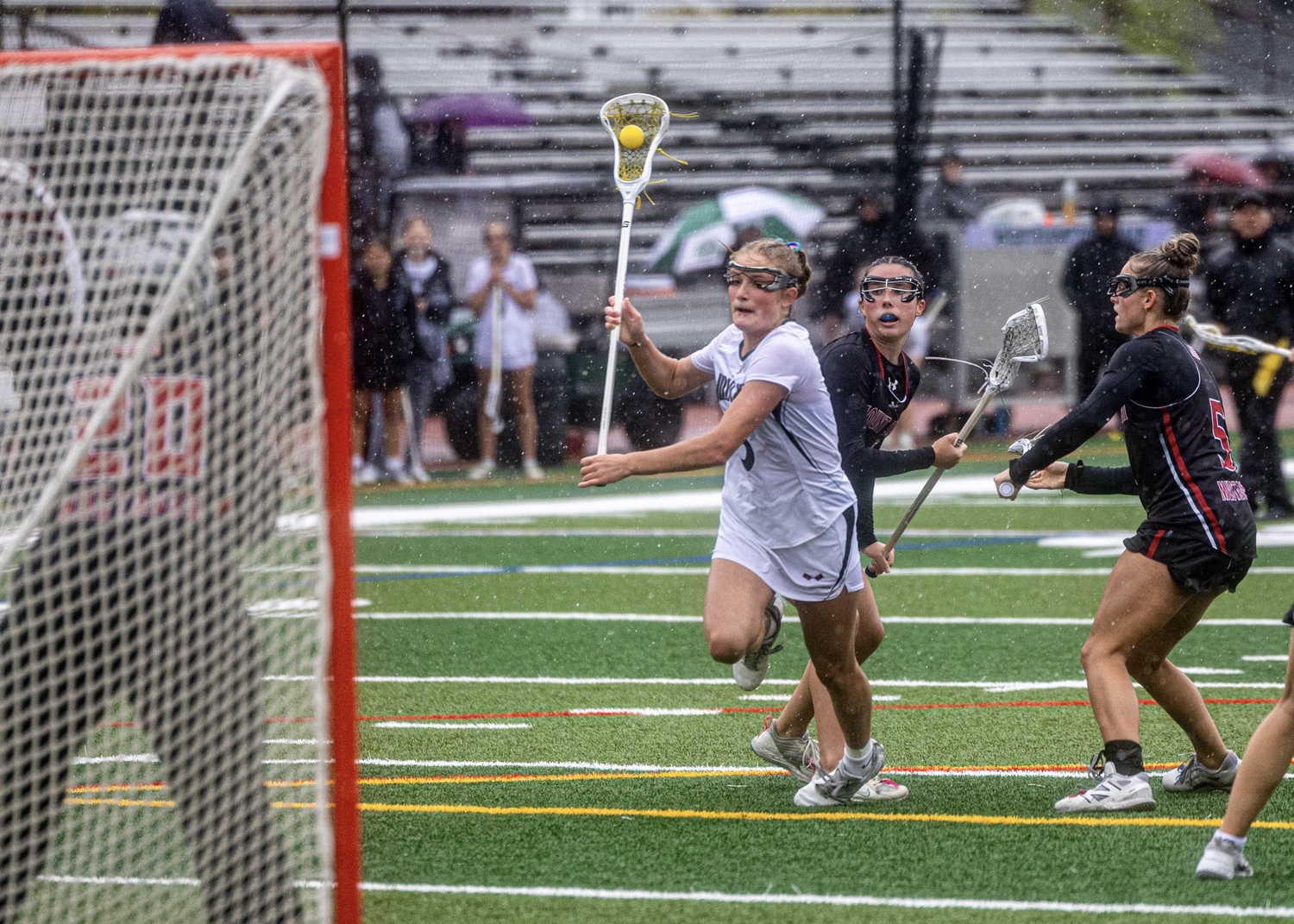 Junior midfielder Lily Graves breaks through Mt. Sinai defenders and winds up to shoot and score. MICHAEL O'CONNOR