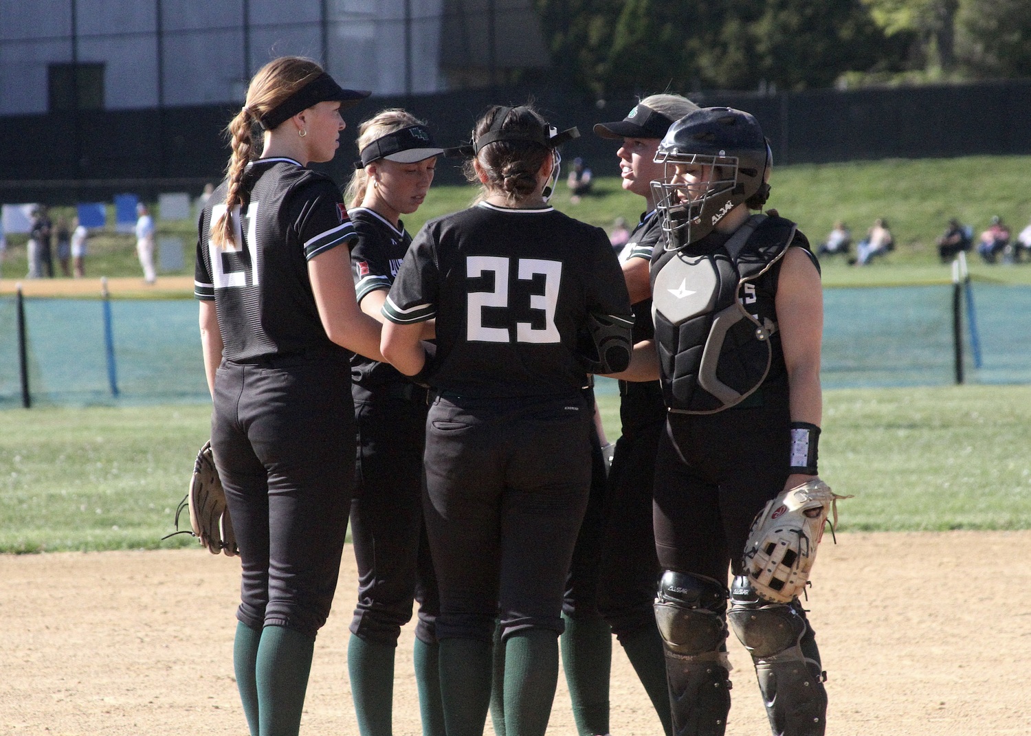 Westhampton Beach's infield comes together before the start of the game against Rocky Point. DESIRÉE KEEGAN