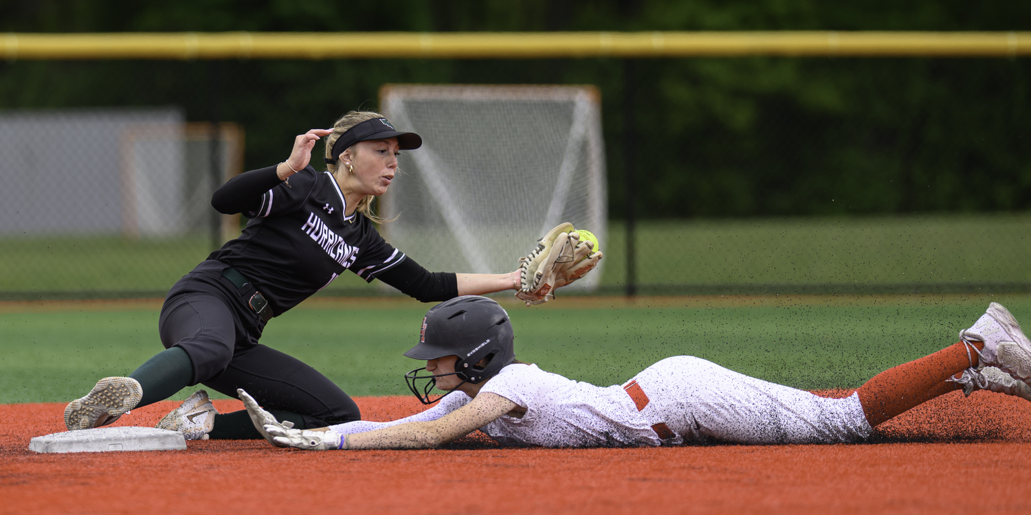 Westhampton Beach shortstop Elliejean Burke is able to keep her foot on the bag to get an East Islip base runner out at second base.   MARIANNE BARNETT