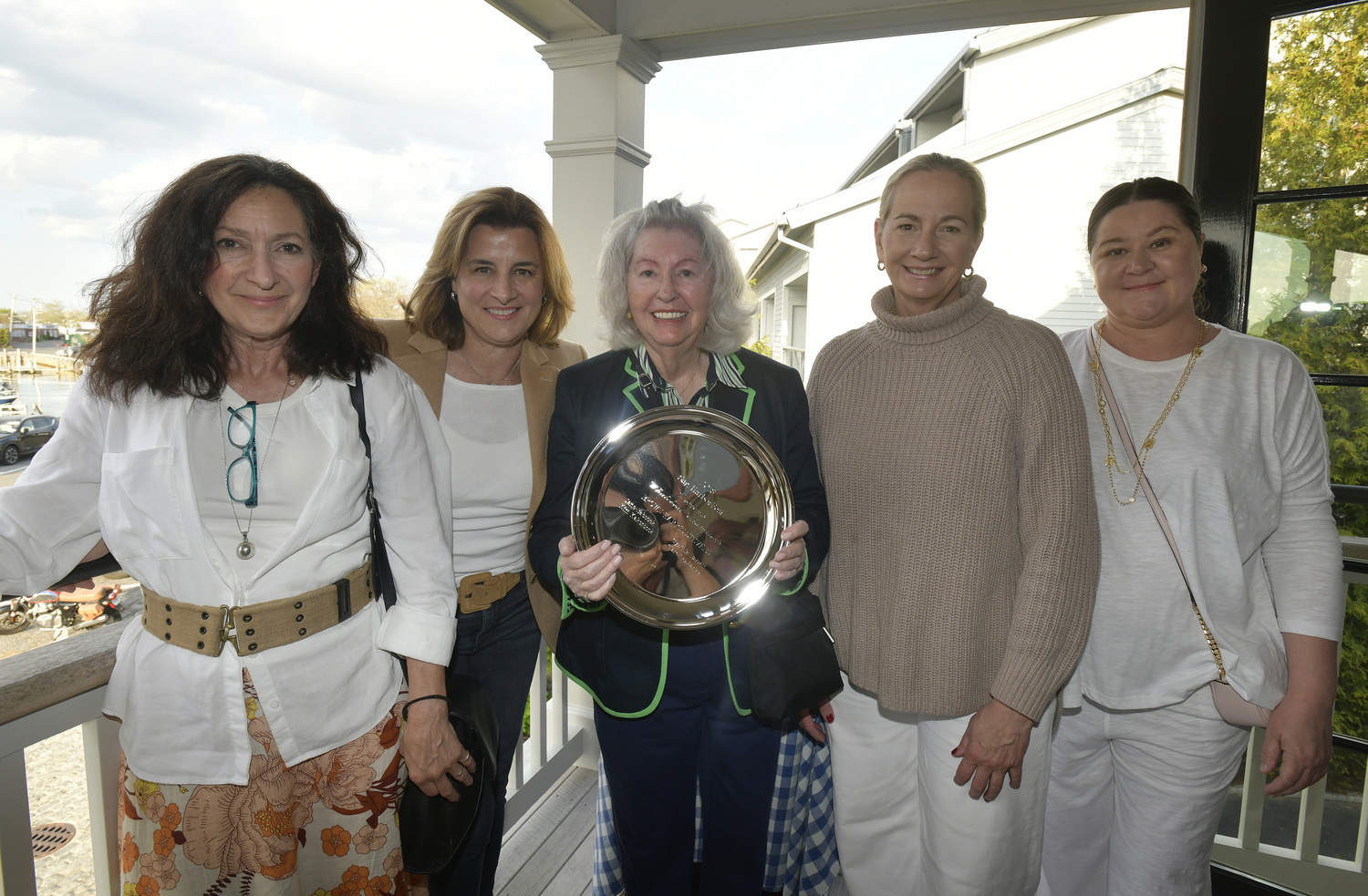 The Brown Harris Stevens 2018 Women's Whaleboat champions, from left, Cynthia  Barrett, Kim Kakerbeck. Jane Holden, Jane Babcock and Clare Tenkarian with their award at the Save the Whale Boats Fundraiser at Baron's Cove in Sag Harbor on April 2.  DANA SHAW