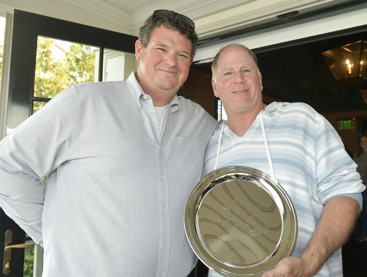 Gavin Menu with Ray Pettigrew of Team Whalers which has won the Whalers Cup nineteen times at the The Save the Whale boats Fundraiser at Baron's Cove in Sag Harbor on April 2.  DANA SHAW
