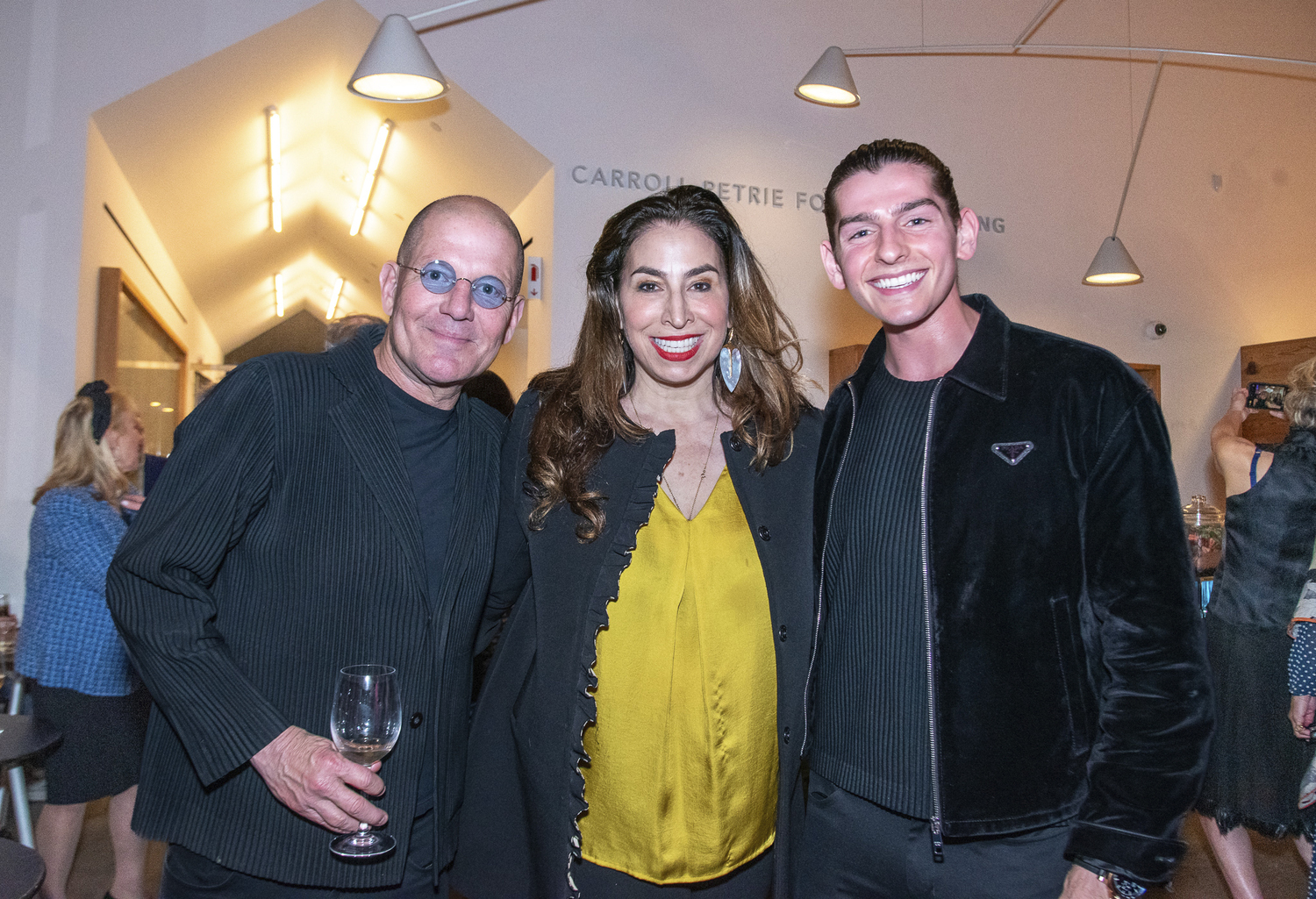 Todd White, Alexandra Stanton and Cameron Carani at the Parrish Art Museum's annual Spring Fling benefit on Saturday in Water Mill.  LISA TAMBURINI