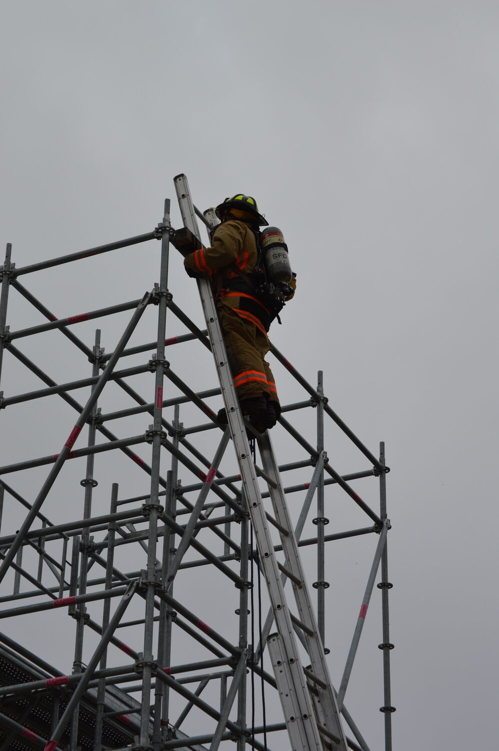 Trainees have to reach the top of the 30' foot ladder to graduate. TOM GOGOLA