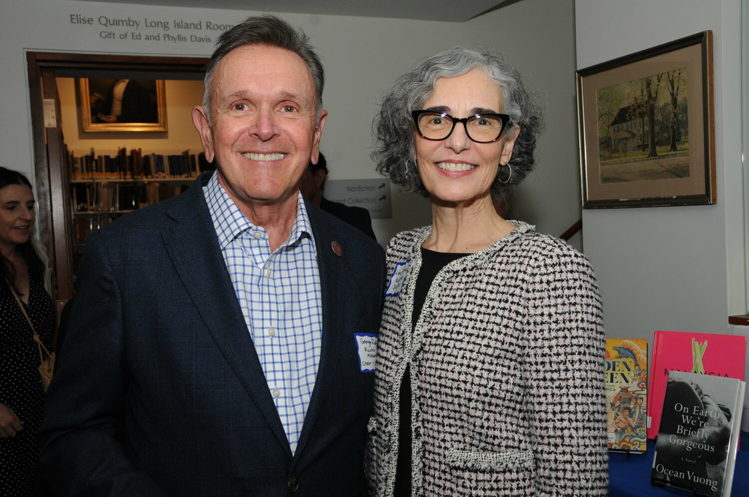 George Ruotolo with Hampton Library Executive Director Lisa Michne at the Hampton Library in Bridgehampton on Saturday evening where the library trustees invited guests to gather at the and see the plans to redesign the library interior. RICHARD LEWIN