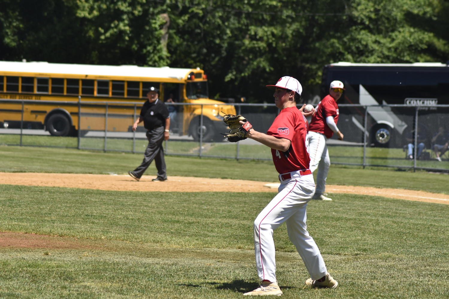 Braeden Mott throws to third base after fielding a bunted ball and gets the force out.   DREW BUDD