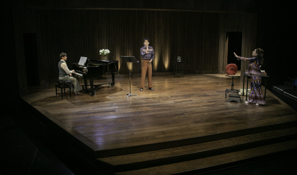 Brett Ryback as accompanist Manny Weinstock,  Rodney Ingram as music student Anthony Candolino and Vicki Lewis as Maria Callas in 