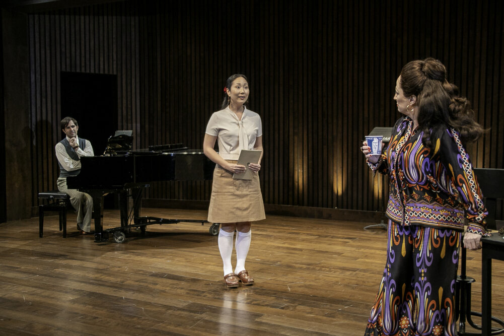 Brett Ryback as accompanist Manny Weinstock,  Stella Kim as music student Sophie De Palma and Vicki Lewis as Maria Callas in 