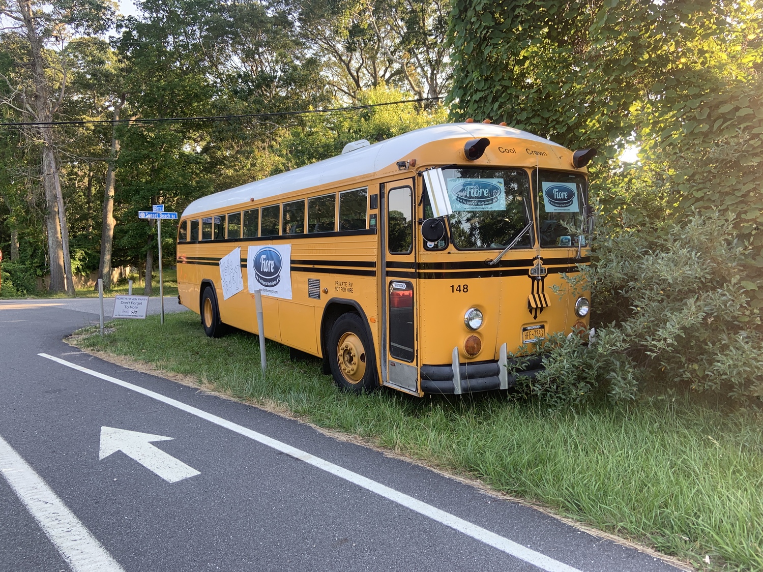 North Haven Mayor Chris Fiore, who has an eclectic car collection, parked his antique California school bus near his house on Tuesday, with signs urging residents to vote. STEPHEN J. KOTZ