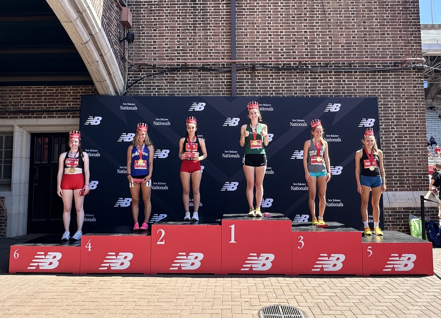 Dylan Cashin stands in fourth place on the podium.