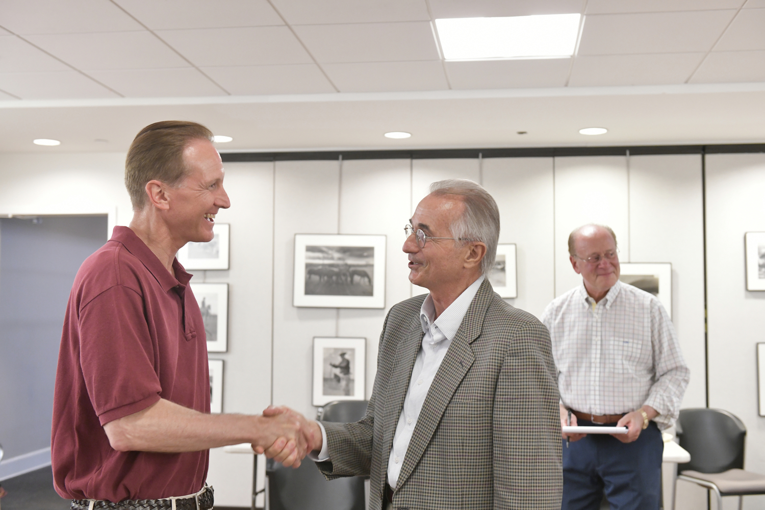 Southampton Village Mayor Bill Manger congratulates Ed Simioni after the election results were in on Friday night.   DANA SHAW