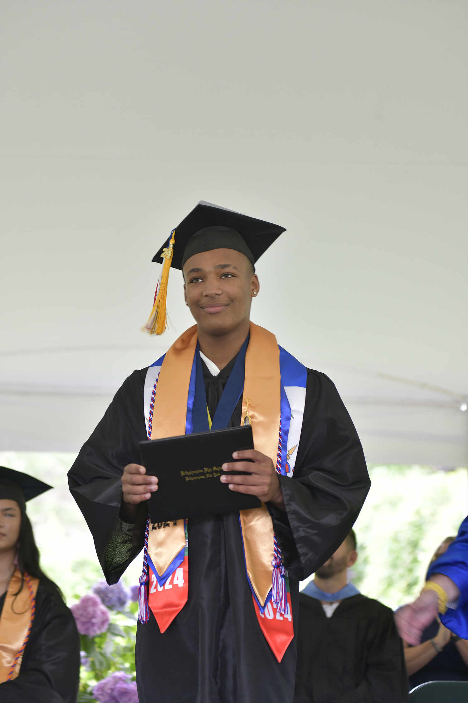 Graduate Mikhail Feaster with his diploma.