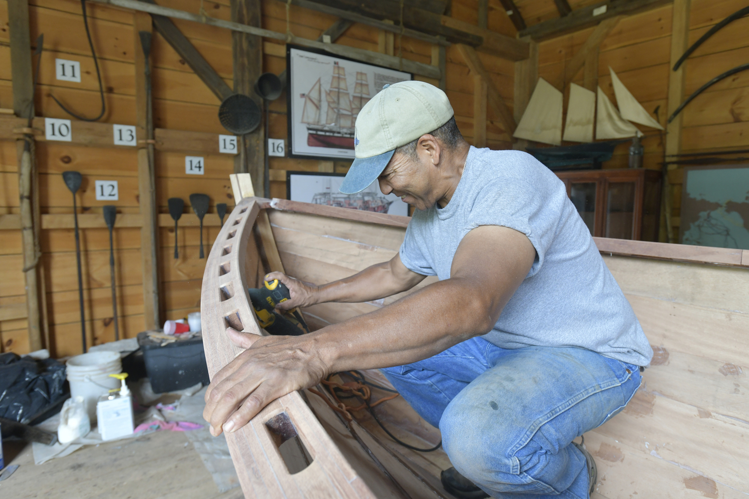 Keith Phillips at work on the Nowedonah at the Southampton Historical Museum.  DANA SHAW